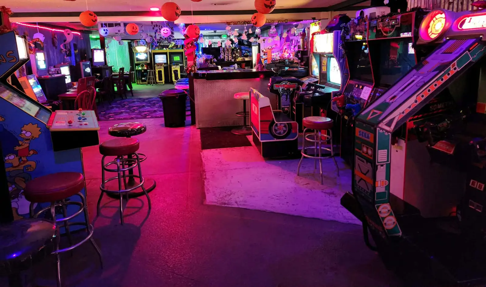 View across the arcade floor toward the bar